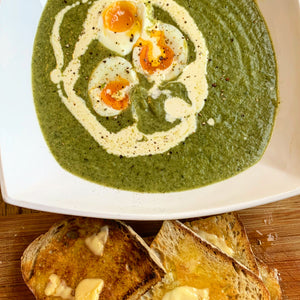 Watercress soup with soft-boiled duck eggs